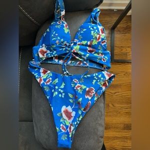 High waisted cheeky bikini. Pretty blue color with super cute back design.